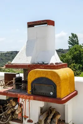 a stove that is sitting on top of a building at House Salvia in Lachania
