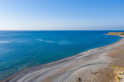 an aerial view of the ocean and a beach at House Almyra in Lachania