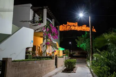 a street at night with a street light at Haraki Sand Beach in Haraki