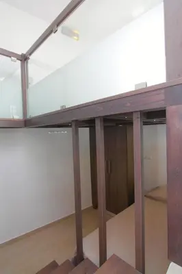 a table in a room with glass walls at Haraki Beauty in Haraki