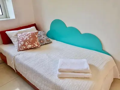a bedroom with a bed with hearts on the wall at The Metropolis Residence Rhodes in Rhodes Town