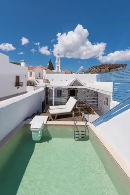a swimming pool on the roof of a building at Casa Blue in Gennadi