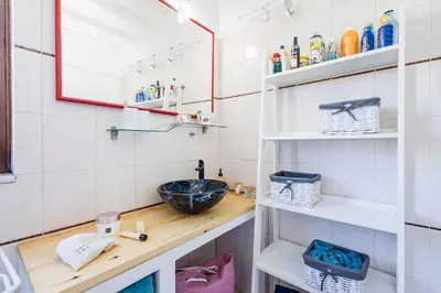 a bathroom with a sink and a mirror at Casa de La Flora by Rhodes4vacation in Rhodes Town