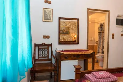 a bathroom with a sink and a toilet and a mirror at Spot Hotel in Rhodes Town