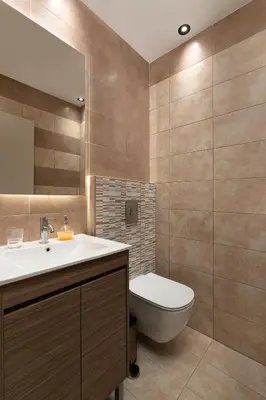 a bathroom with a sink and a toilet and a mirror at Rhodes SkyLine Suites in Ixia