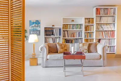 a living room with a couch and a table at Couple's Getaway , Modern Amenities & Sophisticated Style in Rhodes Town