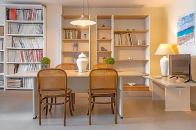 a dining room with a table and chairs at Couple's Getaway , Modern Amenities & Sophisticated Style in Rhodes Town