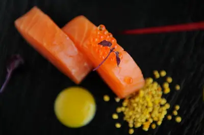 a plate of food with carrots and seeds on a table at ABAV2 Suites by Rodos Palace in Ixia