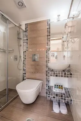 a bathroom with a toilet and a sink and a shower at Kokona in Symi