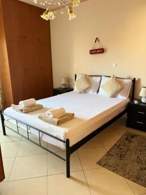 a bedroom with a bed with towels on it at Apartment 29 in Rhodes Town