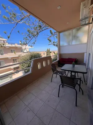 a balcony with a table and chairs and a view at Apartment 29 in Rhodes Town
