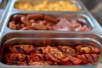 a plastic container filled with hot dogs and other foods at Sunday Hotel in Ialyssos