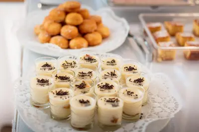 a tray filled with candles and pastries on a table at Sunday Hotel in Ialyssos