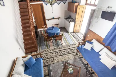 an overhead view of a living room with a table and chairs at Villa Mika in Líndos