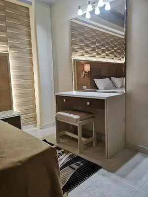 a bedroom with a dressing table with a mirror at Louis Luxury Villa by living in blue in Rhodes Town