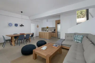 a living room with a couch and a table at Villa Mimosa in Pefkos (Lindos area) in Líndos