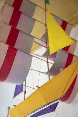a group of colorful umbrellas hanging from a ceiling at Villa Panorama in Symi