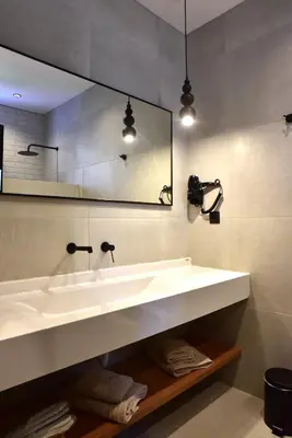 a bathroom with a white sink and a mirror at Rafael Hotel-Adults Only in Líndos
