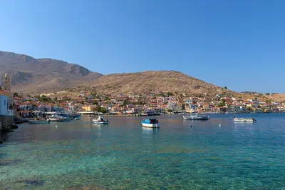 a group of boats in a body of water at Anastasia house in Halki