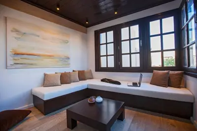 a living room with a couch and a table at Casa Quindici in the Old Town in Rhodes Town