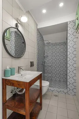 a bathroom with a sink and a toilet and a shower at Casa del Sol Suites in Rhodes Town