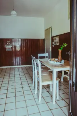 a dining room with a table and chairs at villa62rodos in Kremasti
