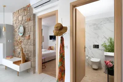a room with a door leading to a bedroom at Ikaros Villa in Pefki Rhodes