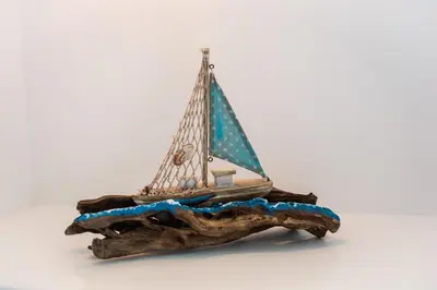 a figurine of a sailboat on a log at Haraki Sea & Sun in Haraki