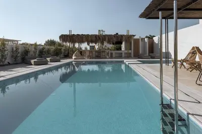 a swimming pool with blue water in a villa at Bianco Villa - Eve in Pefki Rhodes