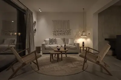 a living room with two chairs and a couch at Bianco Villa - Eve in Pefki Rhodes