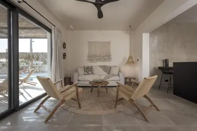a living room with a couch and chairs and a table at Bianco Villa - Eve in Pefki Rhodes