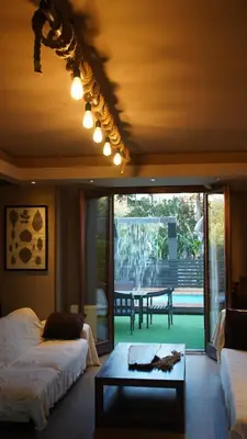 a bedroom with two beds and a table with a view at Villa Astravi in Ialyssos