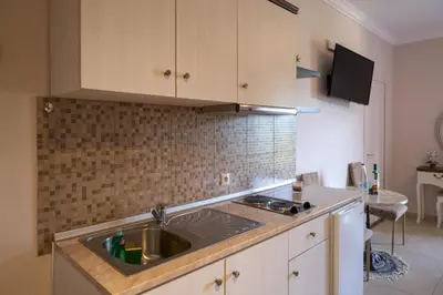 a kitchen with a sink and a counter top at Knights' Castle Studios in Archangelos