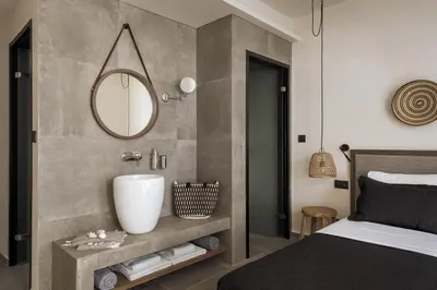 a bedroom with a sink and a mirror on the wall at Bianco Villa - Adam in Pefki Rhodes