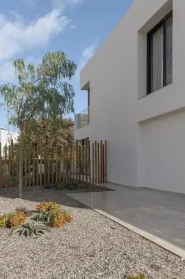 a white house with a fence and a yard at Bianco Villa - Adam in Pefki Rhodes