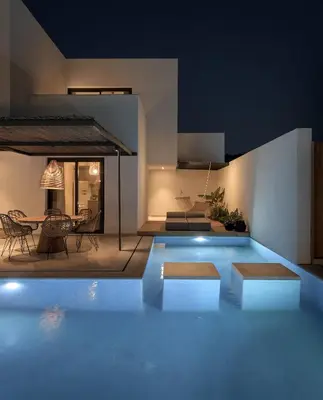a swimming pool in the middle of a house at Bianco Villa - Adam in Pefki Rhodes