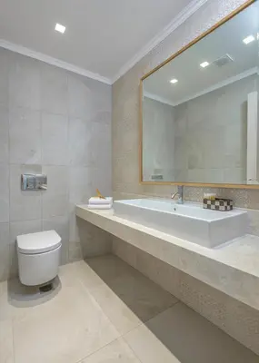 a bathroom with a sink and a toilet and a mirror at Villa Kastro in vlicha