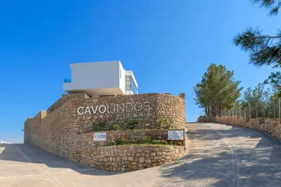 a stone wall with a sign that reads cavalloudos at Villa Akrotiri in vlicha