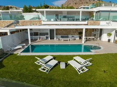 an aerial view of a house with a swimming pool at Villa Akrotiri in vlicha