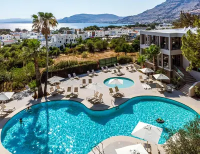 an overhead view of a swimming pool in a resort at White Olive Premium Lindos in Pefki Rhodes