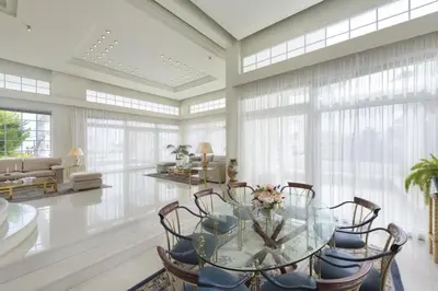 a dining room with a glass table and chairs at City Mansion Rhodes in Rhodes Town