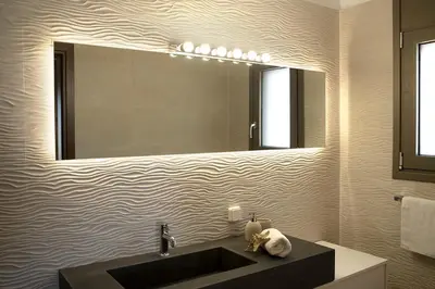 a bathroom with a sink and a mirror at Villa Alkyoni Lindos in Líndos