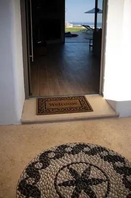 a welcome mat in theoyer of a house at Villa Alkyoni Lindos in Líndos