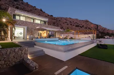a house with a swimming pool in the yard at Lido Blue Villa in Pefki Rhodes