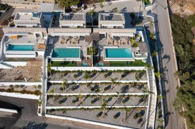 an overhead view of a building with swimming pools at Lido Blue Villa in Pefki Rhodes