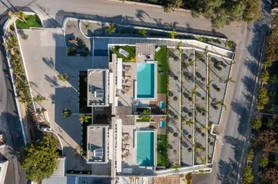 an overhead view of a building with a pool at Lido White Villa in Pefki Rhodes