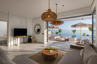 a living room with a view of the ocean at Lido White Villa in Pefki Rhodes