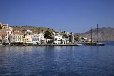 a town on the shore of a large body of water at Limani Life in Symi