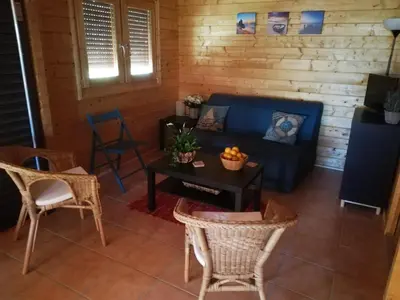 a living room with a blue couch and chairs at Villa Soroni in Soroni