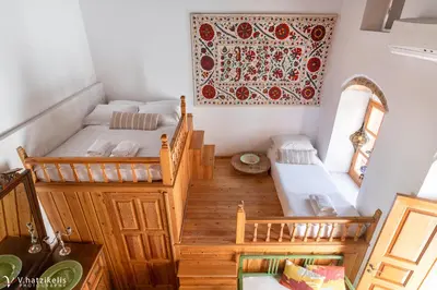 a small room with two beds and a staircase at Villa Lindia in Líndos